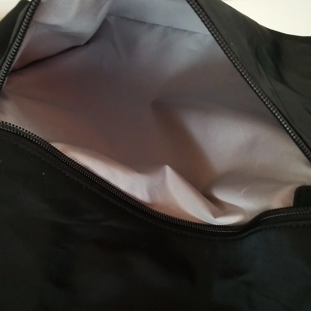 NWOT Tumi Just in Case Backpack in Black and Gold